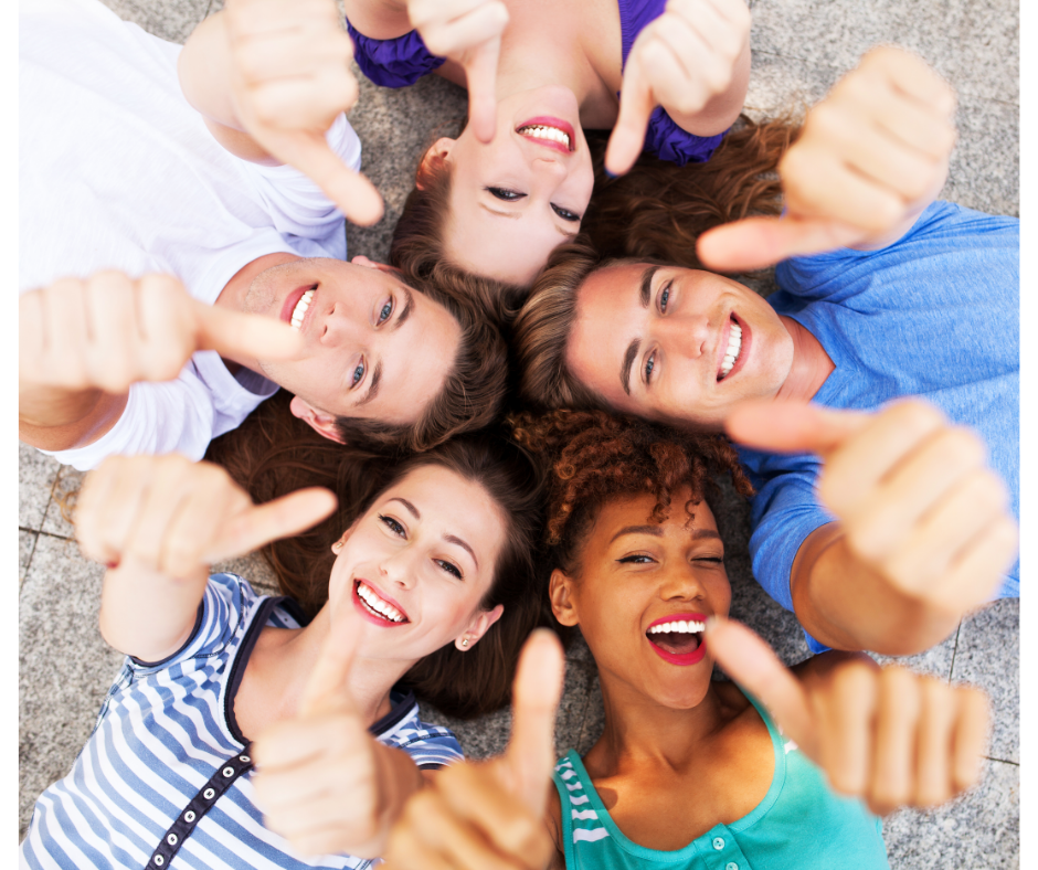 Employee retention is increased when employees are happy.  Happy employees in a circle giving thumbs up.